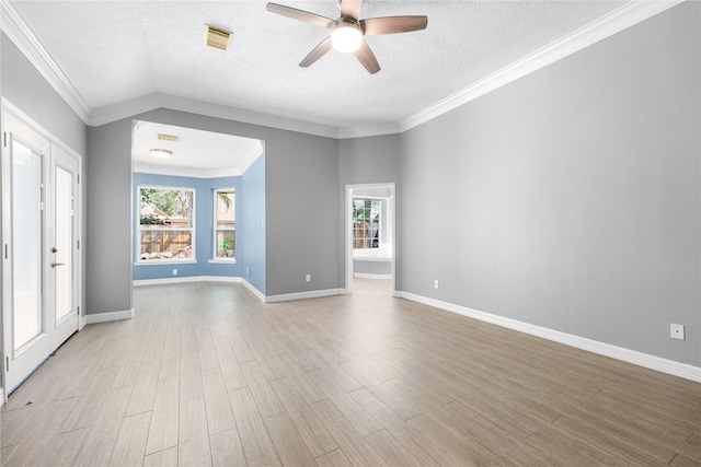 unfurnished room featuring light wood-type flooring, baseboards, a ceiling fan, and visible vents