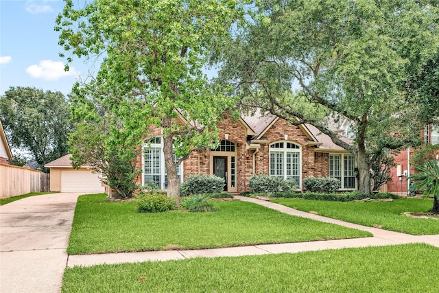 obstructed view of property with a front lawn, brick siding, and a garage