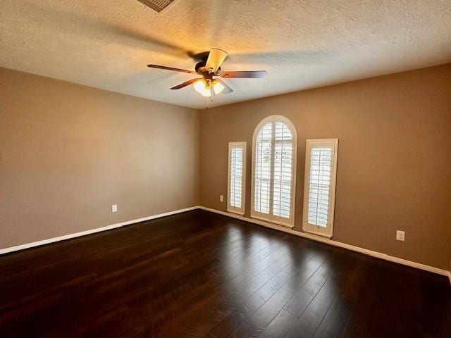2407 Florence Dr, League City, TX 77573 - spare room with dark wood-style flooring, baseboards, a textured ceiling, and ceiling fan