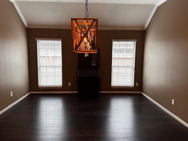 2407 Florence Dr, League City, TX 77573 - interior space with crown molding, baseboards, plenty of natural light, and dark wood-style floors