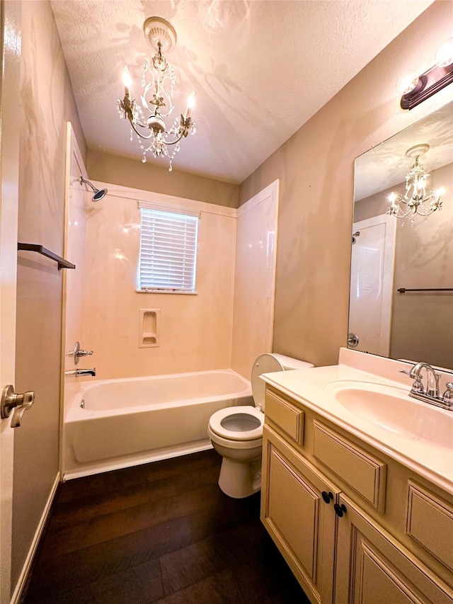 2407 Florence Dr, League City, TX 77573 - full bath featuring vanity, a chandelier,  shower combination, toilet, and wood finished floors