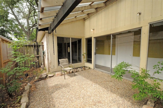 back of property with a patio area and fence