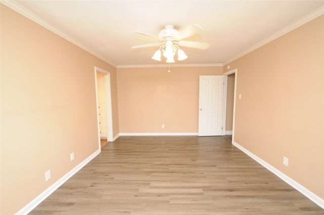 unfurnished room with baseboards, ceiling fan, crown molding, and light wood finished floors