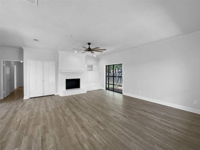 202 Essex Pl, Stafford, TX 77477 - unfurnished living room with wood finished floors, a fireplace, a ceiling fan, and baseboards