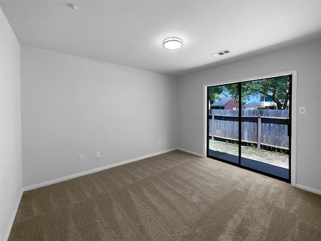 202 Essex Pl, Stafford, TX 77477 - carpeted empty room featuring visible vents and baseboards
