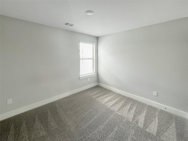10716 Wild Chives, Conroe, TX 77385 - carpeted spare room featuring visible vents and baseboards