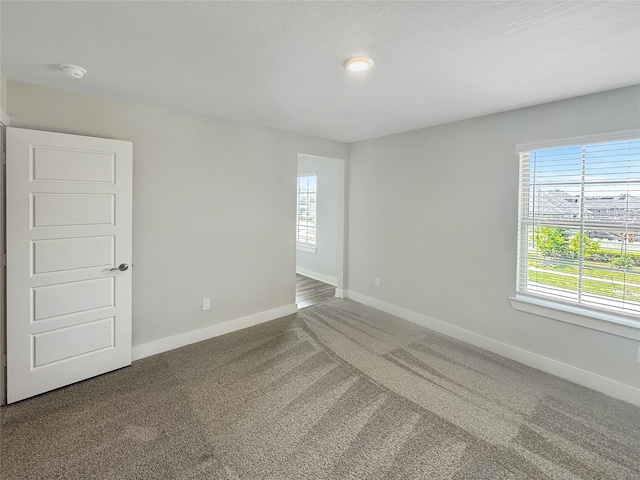 10716 Wild Chives, Conroe, TX 77385 - carpeted spare room featuring baseboards