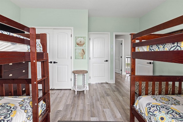 bedroom with wood finished floors