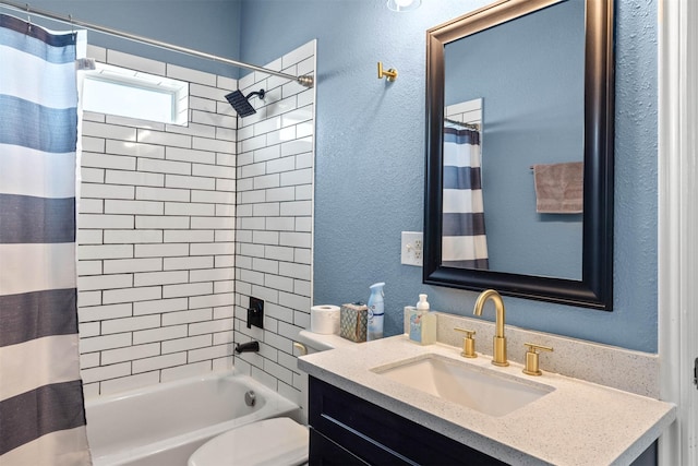 full bathroom featuring toilet, shower / tub combo, a textured wall, and vanity