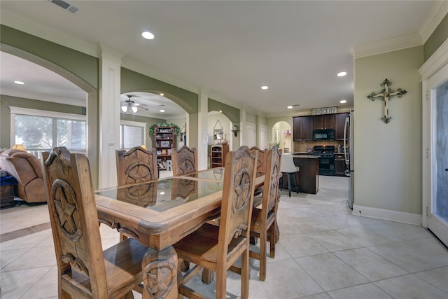 dining area with arched walkways, light tile patterned floors, visible vents, and recessed lighting