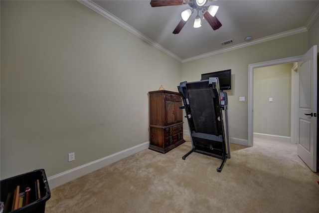 workout area with light carpet, visible vents, crown molding, and ceiling fan