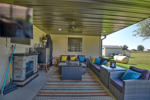 view of patio / terrace featuring an outdoor living space with a fireplace