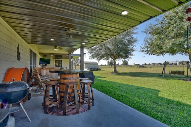 view of patio with a ceiling fan and outdoor dry bar