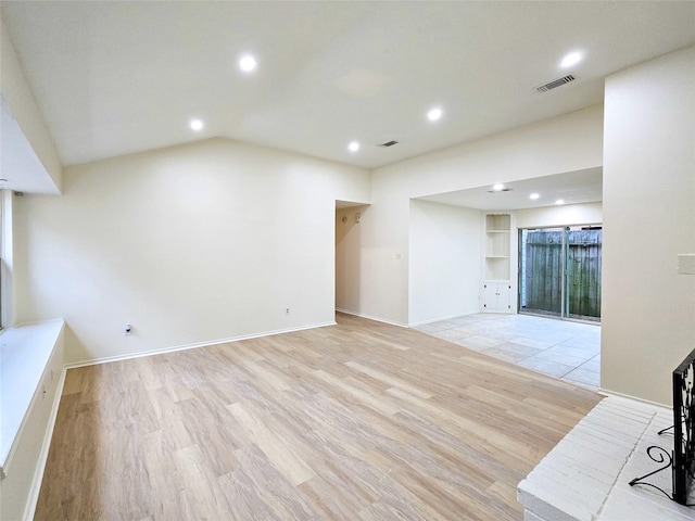 1531 Miller Ave, Katy, TX 77493 - unfurnished living room featuring visible vents, light wood-type flooring, recessed lighting, and lofted ceiling