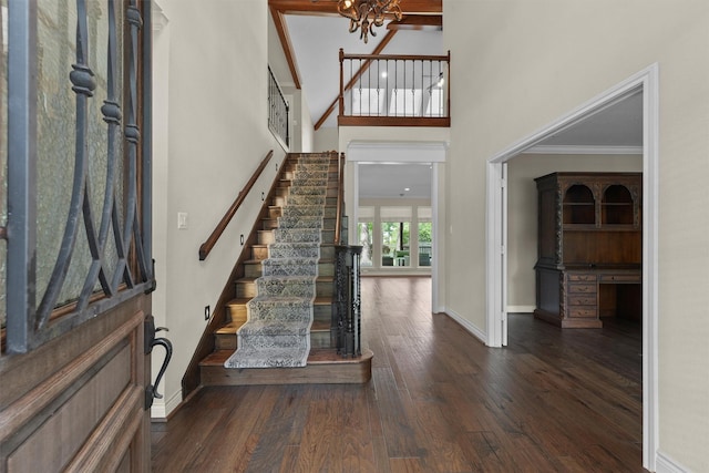 2023 Forest Garden Dr, Kingwood, TX 77345 - entryway featuring wood finished floors, stairs, a chandelier, baseboards, and a towering ceiling