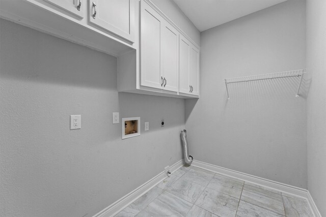 2023 Forest Garden Dr, Kingwood, TX 77345 - clothes washing area with cabinet space, baseboards, hookup for a gas dryer, electric dryer hookup, and washer hookup