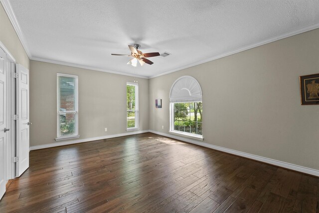 2023 Forest Garden Dr, Kingwood, TX 77345 - unfurnished room featuring ceiling fan, dark wood finished floors, a textured ceiling, baseboards, and ornamental molding