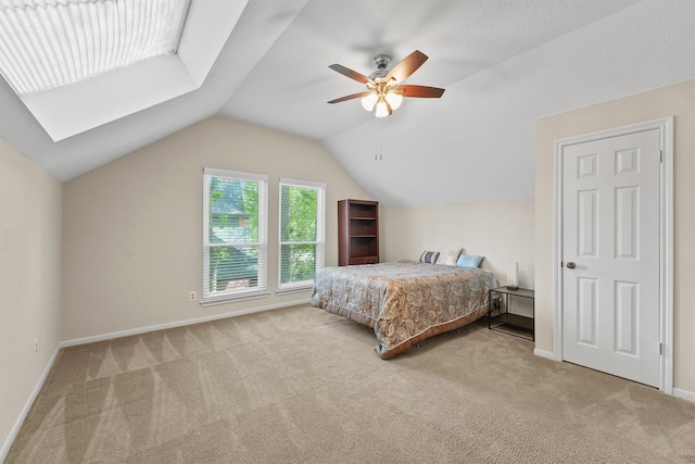 2023 Forest Garden Dr, Kingwood, TX 77345 - bedroom with carpet, vaulted ceiling, baseboards, and ceiling fan