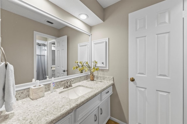 2023 Forest Garden Dr, Kingwood, TX 77345 - full bathroom with vanity and baseboards