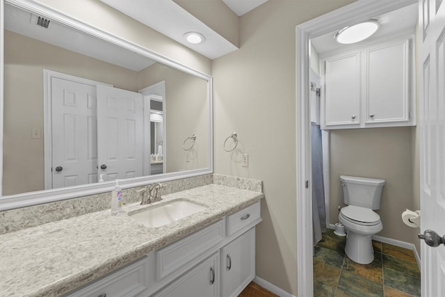 2023 Forest Garden Dr, Kingwood, TX 77345 - full bath with baseboards, vanity, stone finish flooring, toilet, and curtained shower