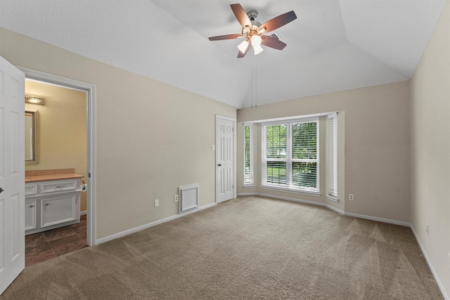 2023 Forest Garden Dr, Kingwood, TX 77345 - carpeted empty room featuring a ceiling fan, baseboards, and lofted ceiling