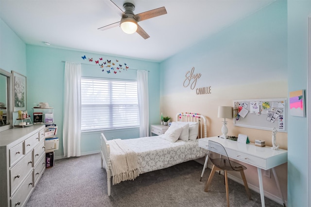 bedroom featuring light colored carpet, ceiling fan, and baseboards