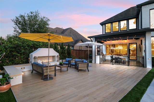 wooden terrace featuring outdoor lounge area