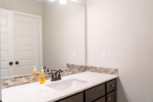 bathroom with backsplash and vanity