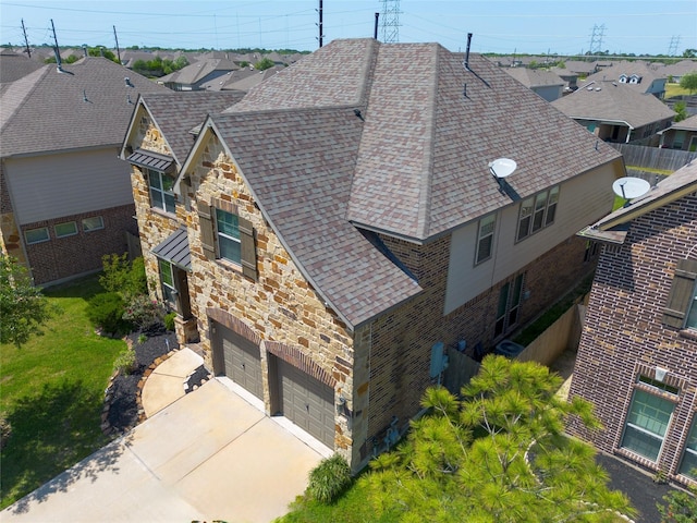 birds eye view of property with a residential view