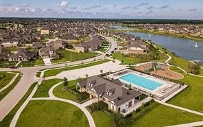 bird's eye view with a residential view and a water view