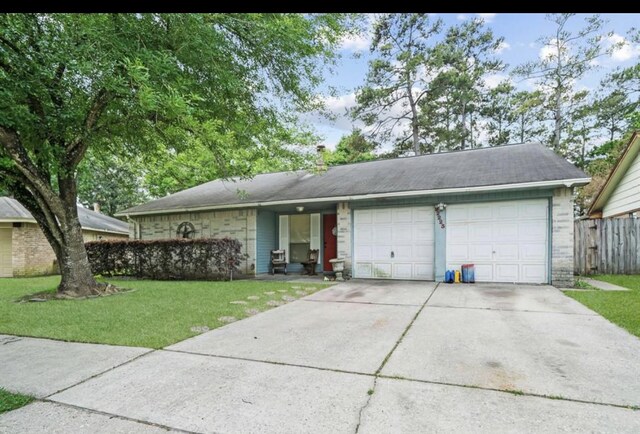 22223 Springgate Dr, Spring, TX 77373 - single story home with fence, an attached garage, a front lawn, brick siding, and driveway