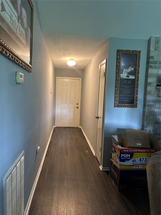 22223 Springgate Dr, Spring, TX 77373 - hall with visible vents, dark wood-style flooring, and baseboards