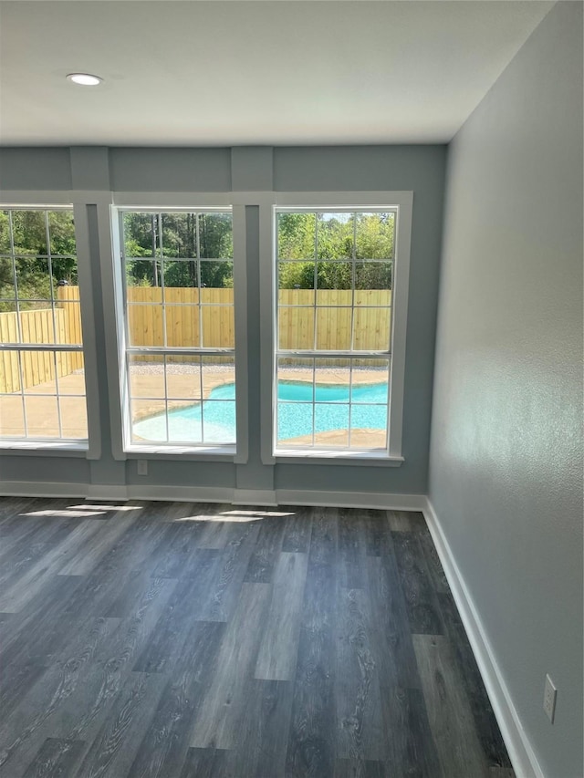 doorway to outside featuring baseboards, recessed lighting, and wood finished floors