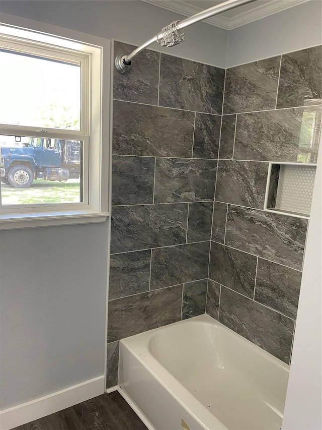 full bathroom with wood finished floors, baseboards, ornamental molding, and a wealth of natural light