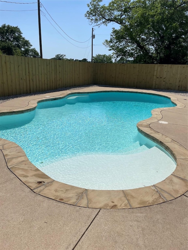 view of pool featuring a fenced in pool and a fenced backyard