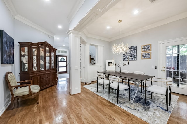1301 Ketch Ct, League City, TX 77573 - dining area featuring ornate columns, ornamental molding, light wood-type flooring, a chandelier, and recessed lighting