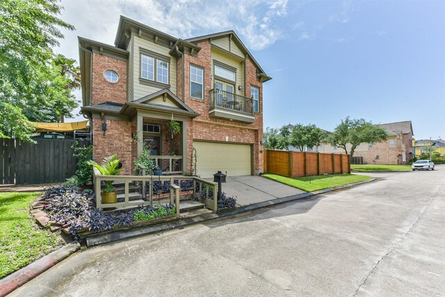 1301 Ketch Ct, League City, TX 77573 - view of front of house with fence, brick siding, an attached garage, and driveway