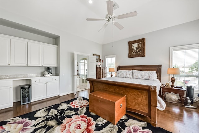 1301 Ketch Ct, League City, TX 77573 - bedroom featuring beverage cooler, dark wood-style flooring, lofted ceiling, ensuite bathroom, and a ceiling fan