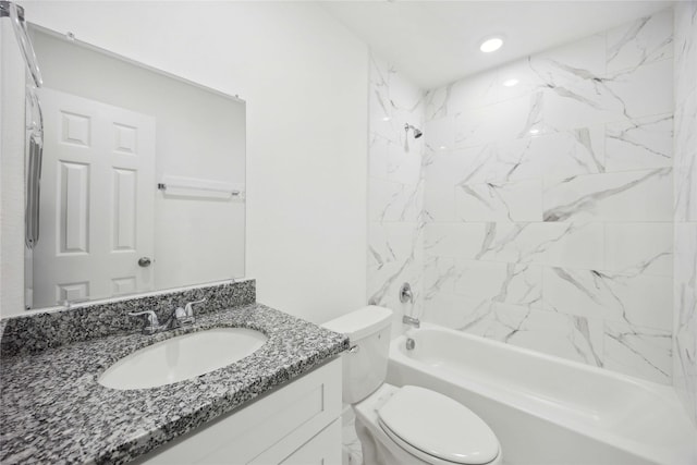 full bath featuring toilet, bathtub / shower combination, and vanity