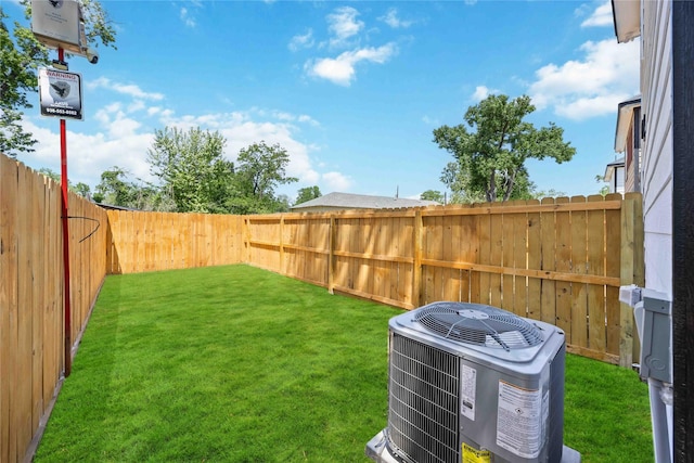 view of yard featuring a fenced backyard and cooling unit