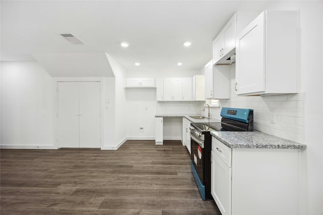 kitchen featuring visible vents, white cabinets, a sink, electric range, and light stone counters