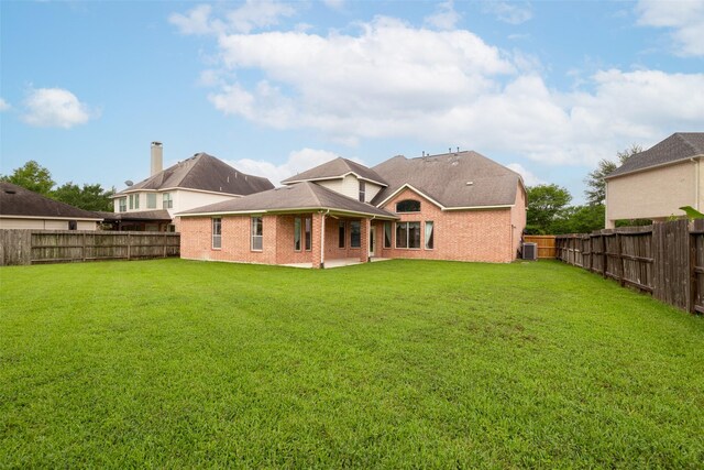 1811 Cambria Ln, Sugar Land, TX 77479 - rear view of house featuring a gazebo, central AC unit, and brick siding
