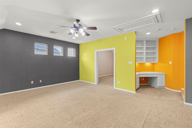 carpeted empty room featuring visible vents, baseboards, attic access, recessed lighting, and a ceiling fan