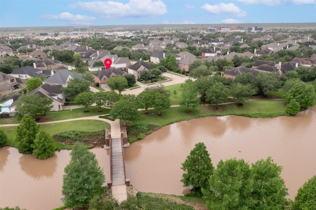 birds eye view of property featuring a water view and a residential view