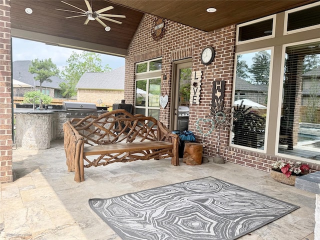 34315 E Short Leaf Pine Ct, Pinehurst, TX 77362 - view of patio with a sink, area for grilling, an outdoor kitchen, and a ceiling fan