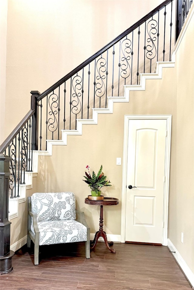 34315 E Short Leaf Pine Ct, Pinehurst, TX 77362 - staircase with a high ceiling, baseboards, and wood finished floors