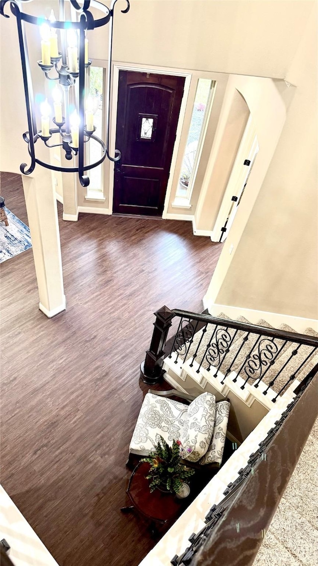 34315 E Short Leaf Pine Ct, Pinehurst, TX 77362 - entryway with a chandelier, wood finished floors, and baseboards