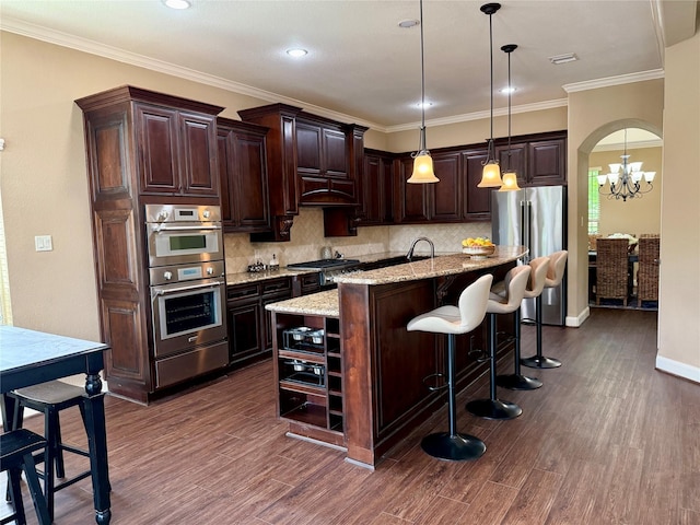 34315 E Short Leaf Pine Ct, Pinehurst, TX 77362 - kitchen featuring a center island with sink, stainless steel appliances, dark wood-style flooring, and a warming drawer