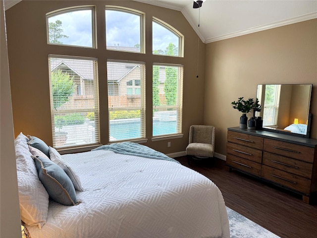34315 E Short Leaf Pine Ct, Pinehurst, TX 77362 - bedroom featuring multiple windows, vaulted ceiling, dark wood-style floors, and crown molding