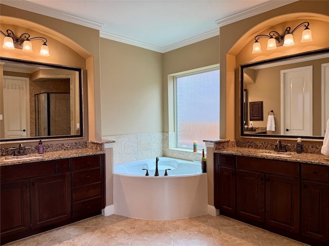 34315 E Short Leaf Pine Ct, Pinehurst, TX 77362 - bathroom featuring a sink, a stall shower, two vanities, and a garden tub